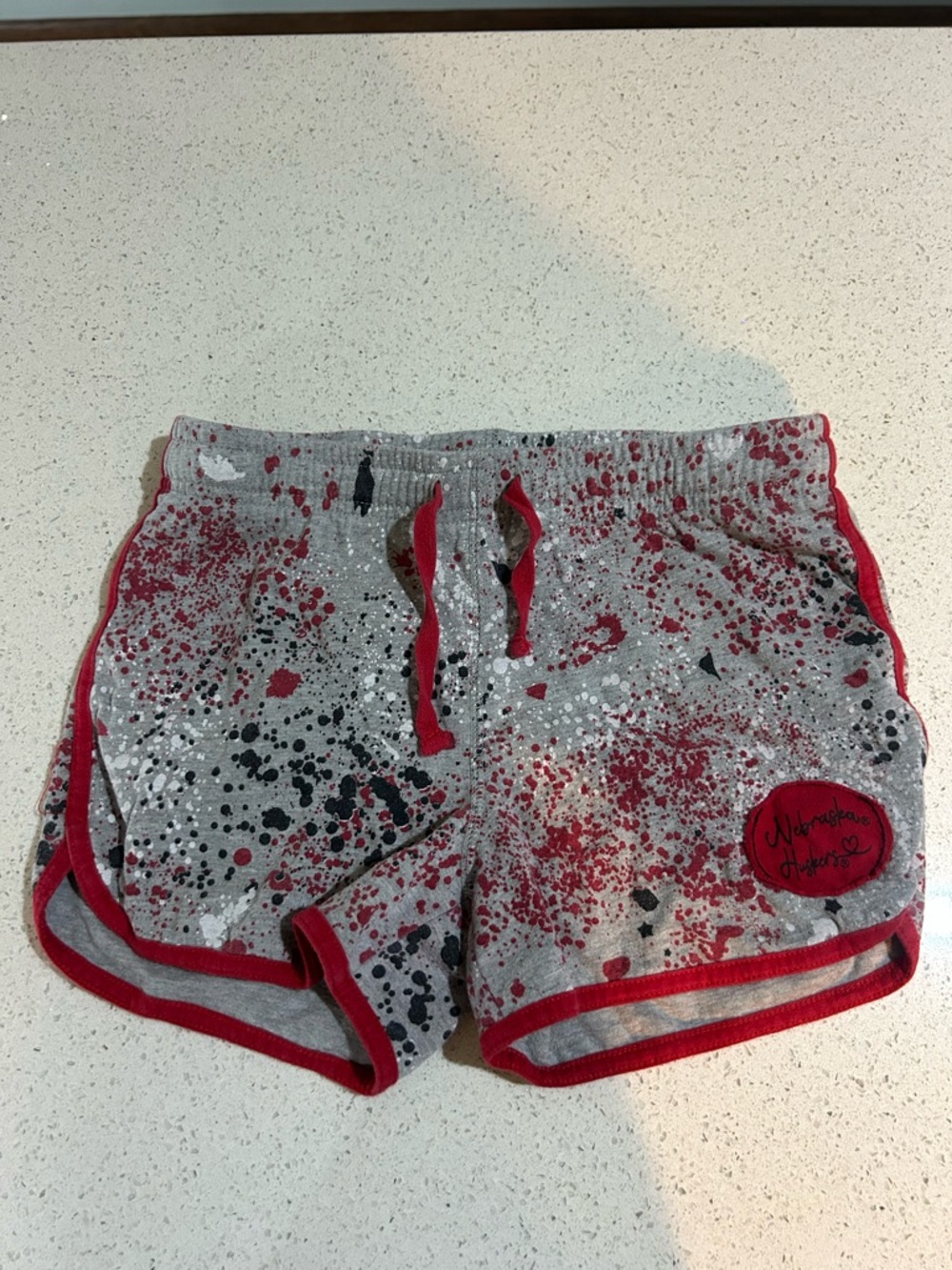 Nebraska Huskers Gray Splatter Athletic Shorts with Red Trim